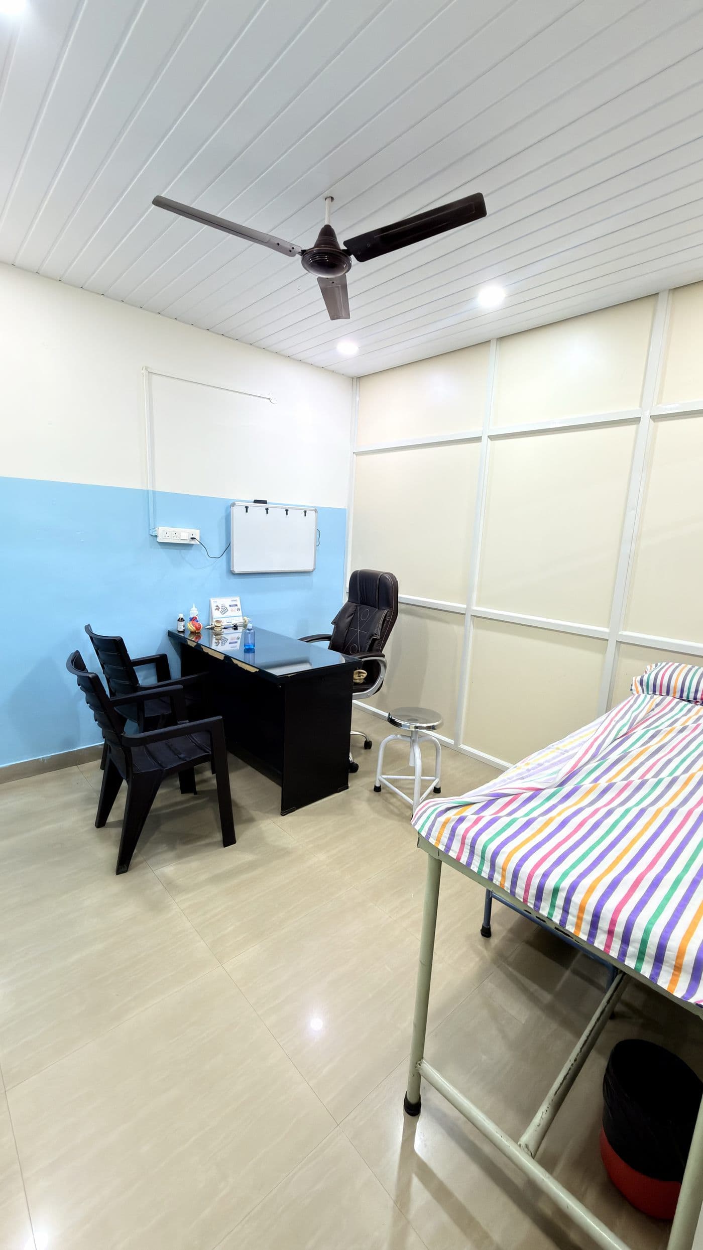 Consulting room with examination couch
